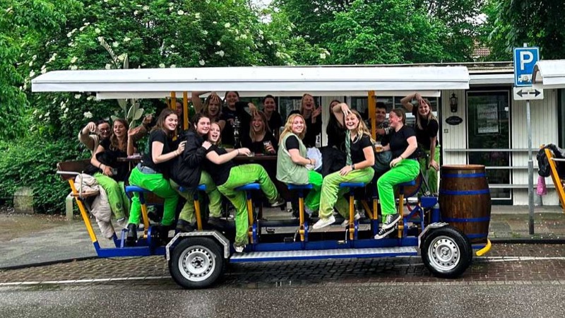 Friends on the beer bike having fun